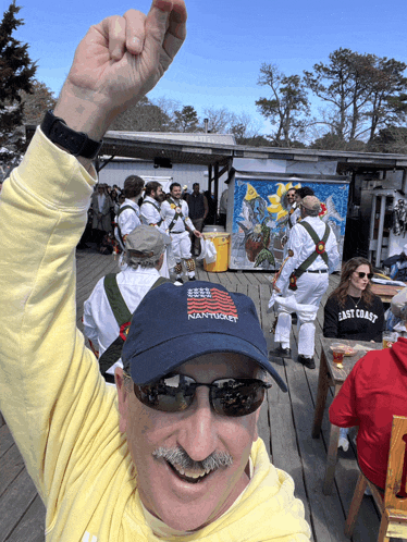 a man wearing a blue hat that says nantucket