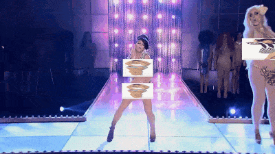 a woman in a bikini stands on a stage holding a picture of herself