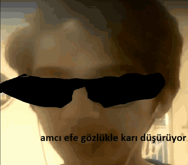a close up of a person 's face with a caption that says amci efe gozlukle kari disuruyor