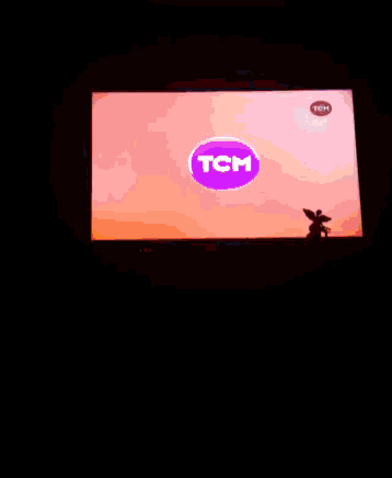 a tv screen shows a tea bag being poured into a glass