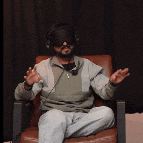 a man wearing headphones and a virtual reality headset