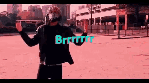 a man wearing a mask is dancing in front of a building in a video .