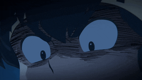 a close up of a cartoon character 's face with a dark background