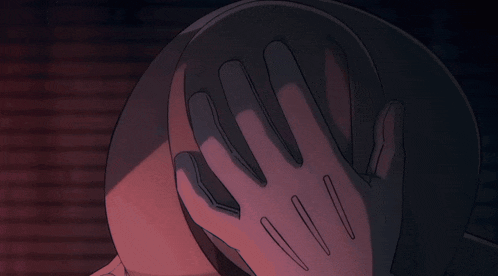 a hand is covering a person 's face in a cartoon