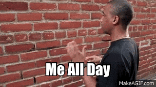a man is standing in front of a brick wall and says me all day