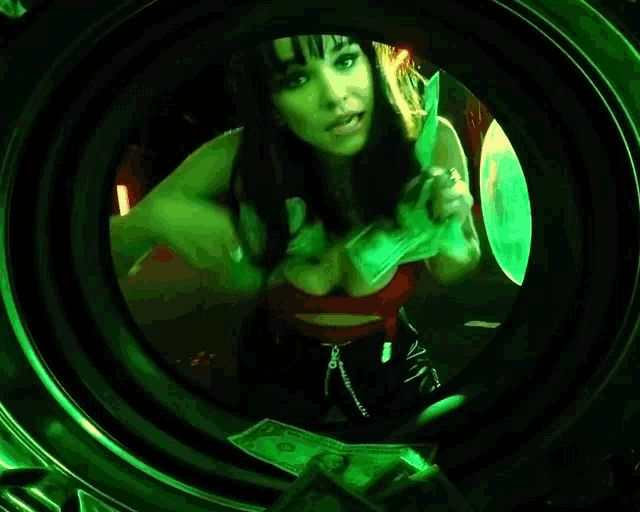 a woman is standing in a washing machine surrounded by money