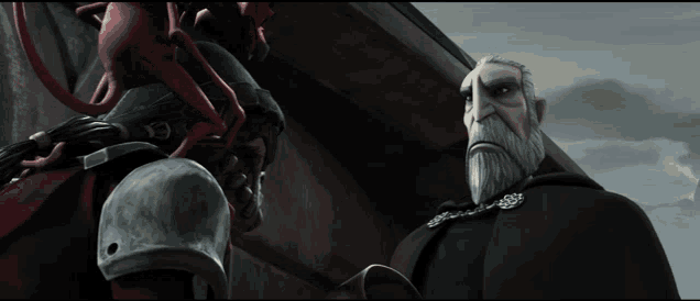 a man with a beard is standing next to another man in a cape