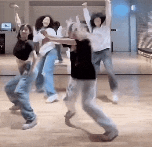 a group of women are dancing together in a dance studio .