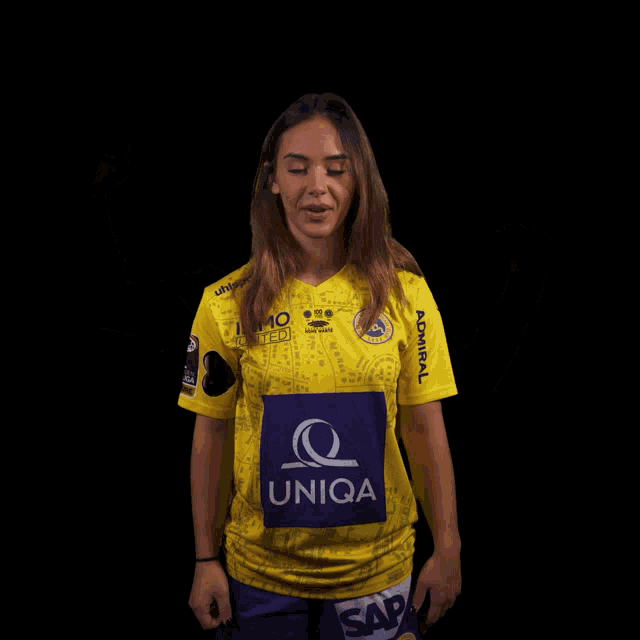 a woman wearing a yellow shirt that says junga