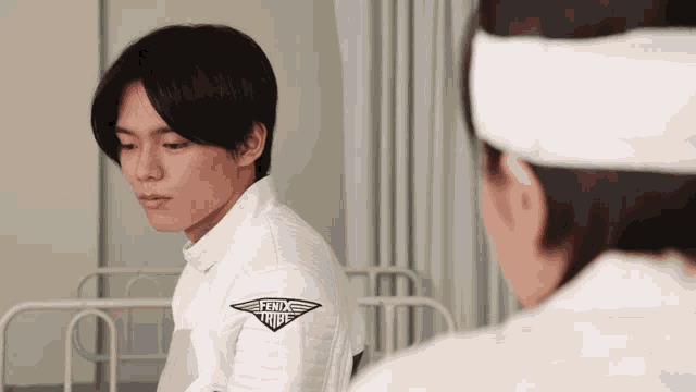 a man in a white shirt with the word felix on it