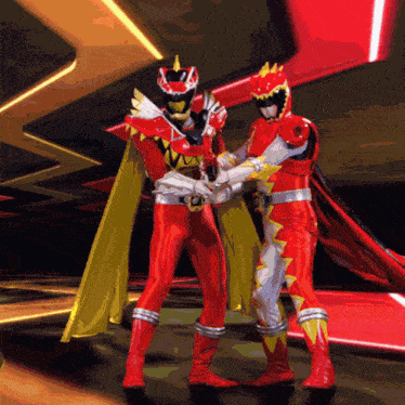 two power rangers are standing next to each other and one is holding a gun