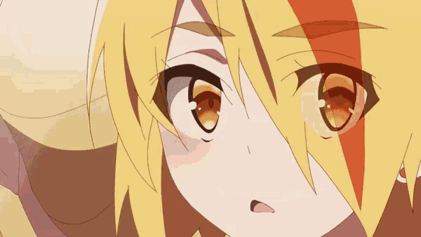 a close up of a cartoon character with yellow hair and orange eyes making a funny face .
