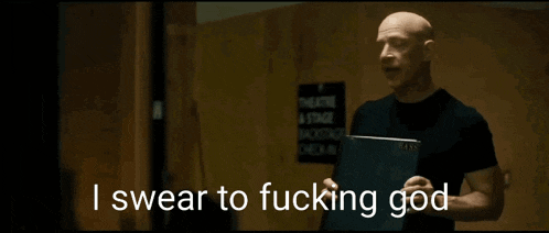 a bald man is holding a sign that says " get the fuck outta my sight before i demolish you "