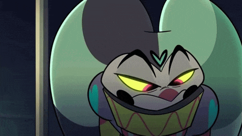 a close up of a cartoon character with a very angry face and yellow eyes .