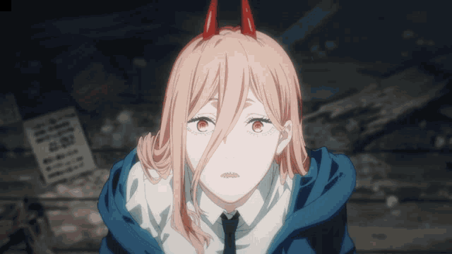 a girl with long hair and red horns looks at the camera