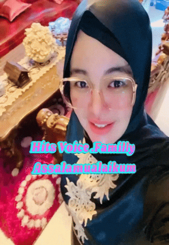 a woman wearing glasses and a hijab with the words hits voice family assalamualaikum on the bottom