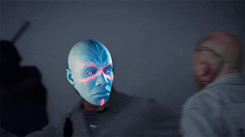 a bald man looks at a blue and red face