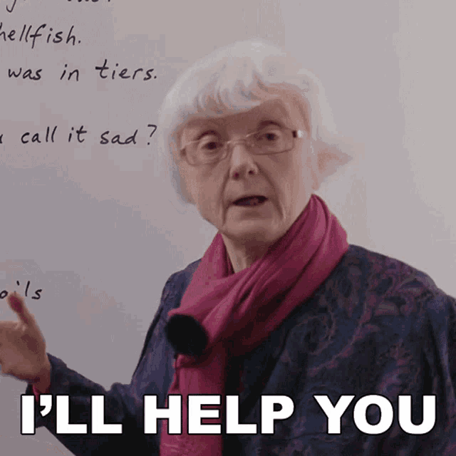an elderly woman says i 'll help you while standing in front of a whiteboard