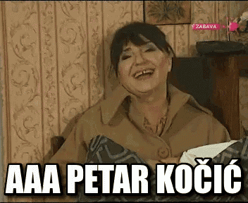 a woman is laughing while sitting in a chair with the words aaa petar kocic on the screen .