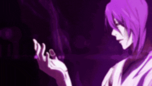 a purple haired anime character is holding something in his hand .