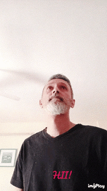 a man with a beard wearing a black shirt that says hii