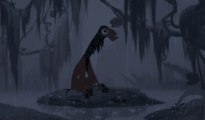 a cartoon character is standing on a rock in the rain .