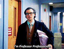a man in a suit and tie is walking down a hallway and says i 'm professor professorson