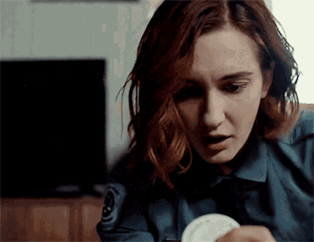 a woman in a police uniform has a patch on her arm that says ' s.p.d. ' on it