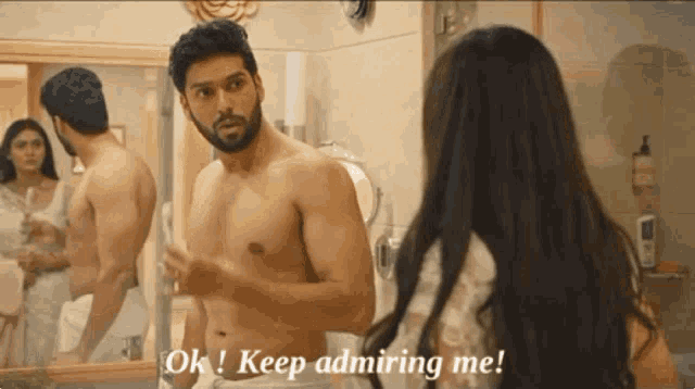 a shirtless man is talking to a woman in a bathroom and says " ok keep admiring me "