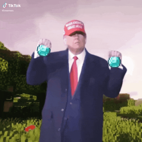 a man wearing a make america great again hat is holding two diamonds in his hands