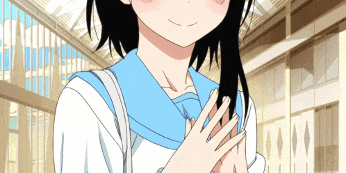 a girl with black hair and a blue scarf around her neck is smiling