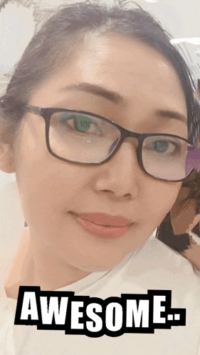 a woman wearing glasses says awesome on the bottom of her face