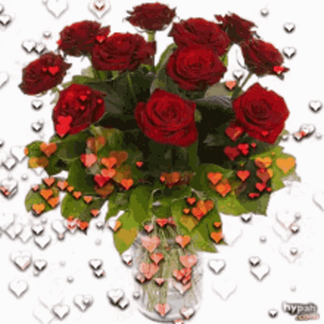 a bouquet of red roses in a vase with hearts surrounding them