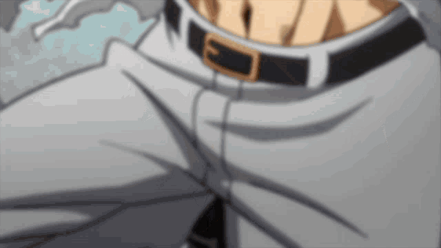 a close up of a person 's pants with a buckle
