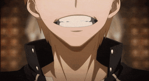 a close up of a man 's face with his mouth open and teeth showing