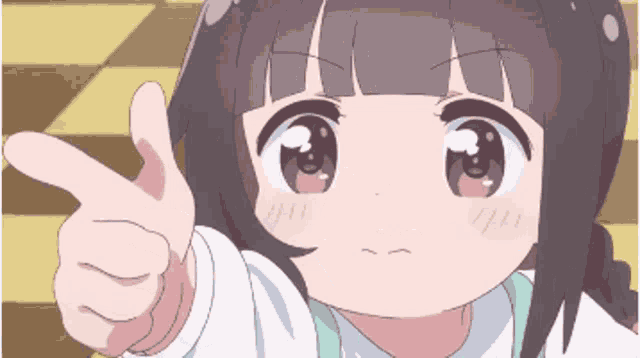 a little girl is giving a thumbs up with her finger