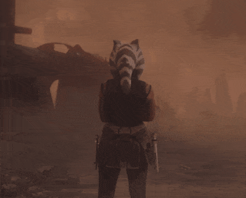 a woman with a tiger 's tail on her head is standing in the fog