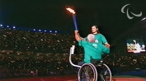 Holding The Torch International Paralympic Committee GIF - Holding The Torch International Paralympic Committee Paralympics GIFs