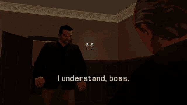 two men are standing in a dark room with the words " i understand boss " above them