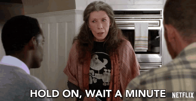 a netflix ad shows a woman talking to a man and says hold on wait a minute