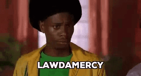 a man wearing a yellow jacket and a green shirt is making a funny face and saying lawdamery .