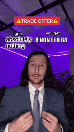 a man in a suit and tie making a funny face