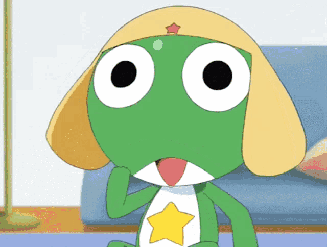 a green frog with a yellow star on its head