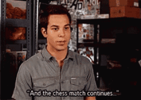 a man says " and the chess match continues " in a warehouse
