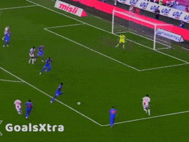 a soccer game is being played on a field with ads for oto eksportiz