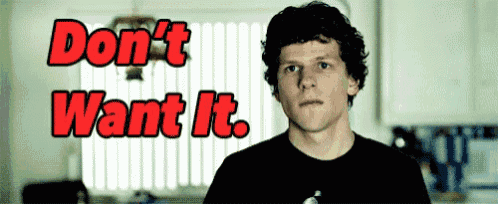 a man in a black shirt is standing in front of a sign that says " do n't want it "