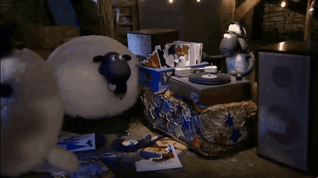 a cartoon sheep is standing in front of a record player that says ' sheep ' on it