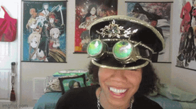 a woman wearing a hat with goggles on it is smiling