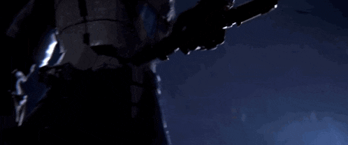 a blue light is shining on a very dark room