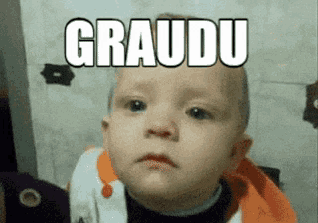 a baby making a sad face with the word graudu above him